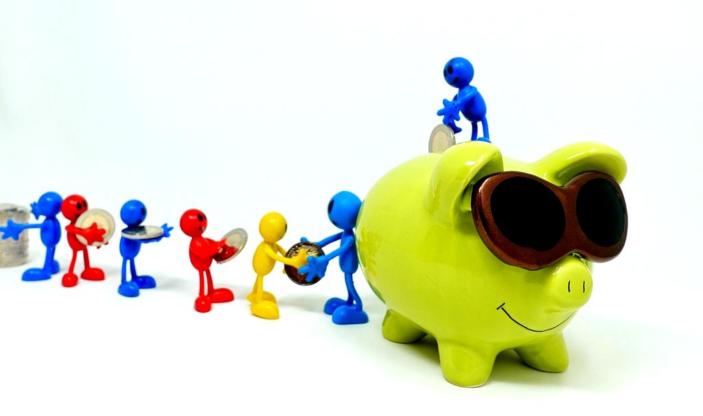 Piggy bank and coins on table